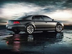 an image of a car that is parked in the rain