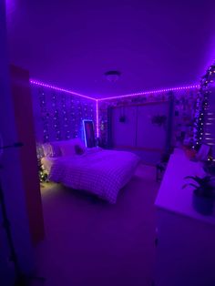 a bedroom with purple lights on the walls