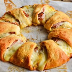 a pastry with ham and cheese on it