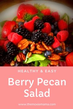 berry pecan salad with almonds, blueberries and raspberries on top