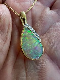 "This striking pendant is crafted in solid 18k gold and features a fabulous Australian crystal opal adorned with diamonds. *Includes* solid gold 18k chain (or I can revise the price if you only want the pendant)  price can be lower depending on payment method.  details to follow... **You can pay in instalments (layaway **Returns accepted** **Buy with confidence - see my reviews** **Offers welcome** **Fast and free shipping** Certification - I can arrange an independent insurance valuation from a high street jeweller at cost (usually £10- 20)  Pictures form the main part of the description, please email if you have questions before purchasing and I'll be happy to try and help. Any box shown not included unless stated, all items sent in vintage, antique or new gift box. *Instagram/Video/Pict Diamond Cabochon Necklace For Anniversary, Diamond Cabochon Pendant Necklace, Luxury Hallmarked Opal Jewelry, Luxury Opal Pendant Necklace, Formal Opal Necklace With 17 Jewels, Gold Diamond Necklace With Cabochon, Formal Opal Pendant Jewelry, Elegant Ethiopian Opal Pendant Necklace, Luxury Ethiopian Opal Jewelry For Anniversary