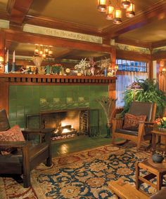 a living room filled with furniture and a fire place in the middle of a room