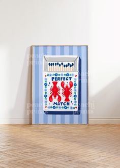 a blue and white striped wall with a red lobster cross stitch pattern on the front