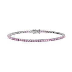 Enhance your jewelry collection with the captivating beauty of our Pink Sapphire Tennis Bracelet. Adorned with vivid pink gemstones, this exquisite piece radiates elegance and charm. Available in 14K Yellow Gold and White Gold Carat weights are reflective of a 7in bracelet. Shorter lengths will have lower carat weights that those listed. Gemstones are natural, therefore colors may vary Pink Cubic Zirconia Bangle Bracelets, Luxury Pink Jewelry With Prong Setting, Elegant Pink Jewelry With Vvs Clarity, Fine Jewelry Tennis Bracelet With Gemstone, Pink Diamond Wedding Bracelets, Classic Pink Cubic Zirconia Jewelry, Fine Jewelry Bracelets With Round Cut Gemstone, Pink Bangle For Formal Occasions, Classic Pink Round Cut Jewelry