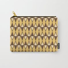 a brown and white pattern with gold zipper pouch