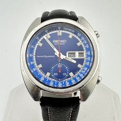 Rare Seiko Vintage Automatic  Men's Speedtimer Watch Rare Blue Bruce Lee dial with silver luminous hands & indices  Speedtimer chronograph works perfectly and resets to 0 properly New old stock leather strap fits wrists 6 3/4" to 8.25"  automatic movement in excellent working condition & keeping accurate time  crowns at 2 & 3 o'clock  Date & English/Spanish Day wheel. Case and caseback in good shape showing light scratches from normal use Ships immediately. Vintage Chronograph Watch With Tachymeter For Business, Collectible Analog Chronograph Watch With Round Dial, Collectible Analog Chronograph Watch, Vintage Chronograph Watch With Analog Display For Business, Vintage Blue Watch With Tachymeter, Retro Chronograph Watch With Subdials For Formal Events, Vintage Automatic Chronograph Watch For Business, Vintage Chronograph Analog Watch For Business, Vintage Chronograph Analog Business Watch