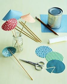 craft supplies are arranged on a table with scissors and other items to make paper crafts