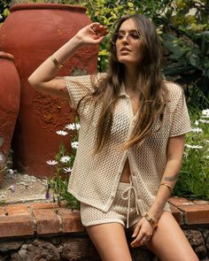 Timeless celebrant of hot sands and dark tans, the Málaga Crochet Knit Shirt features a soft cotton feel and a lightweight, unlined exposure that transcends the limits of blissfully long summer days. Notable features include a shell button front placket and loose sleeves. Don’t forget to pair with the Málaga Short! Designed with love in California Unlined crochet knit Shell buttons Relaxed Fit 60% Cotton, 40% Polyester Made in Indonesia Ships within 1-2 business days.