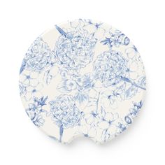 a blue and white plate with flowers on it