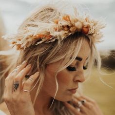 Designed with a bohemian bride in mind, this stunning Athena dried flower crown wedding headband makes the perfect finishing touch to your special day.Each flower crown is handmade in Britain by Luna and Wild.Featuring a selection of premium quality dried flowers and grasses in peach, cream and rust tones wrapped around a wire base that can be bent to fit any head size and is adjustable at the back with an ivory ribbon tie.Choose between the standard ivory satin ribbon option or for a premium fi Rustic Flower Crown Wedding, Bridesmaid Flower Crown Autumn, Autumn Wedding Flower Crown, Autumnal Wedding Hair, Boho Wedding Hair Flowers Crowns, Bridal Flower Crown With Veil, Bridal Flower Crown Boho, Autumn Flower Crown, Bohemian Fall Wedding