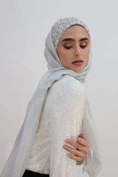 Gorgeous Embroidered Handmade Silver Turban is made with care and love and paired with a 100% Pure Soft Silk Shawl (28"x 72") or a Tulle Shawl (27"x72") for a more dramatic glimpse. You have the option to choose the look you’re looking for. This Silver Glow Set is perfect for an extremely elegant and royal look on your special occasions. Whether it’s for your wedding or engagement party it will add the wow factor to your look. Even if you decided to wear it as a bridesmaid or just for attending Elegant Scarves For Eid Festival, Elegant Festive Scarves For Eid, White Wedding Scarves For Festive Season, Embroidered Scarves For Wedding And Eid, Embroidered Wedding Scarves For Eid, Traditional White Hijab For Wedding, Elegant Shawl For Eid Celebration, Hijab Magnets, Tulle Shawl