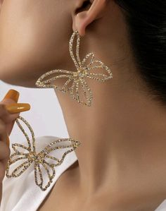 Introducing our enchanting Sparkle Butterfly Silhouette Earrings - the perfect accessory to add a touch of whimsical elegance and fluttering charm to your style! These earrings feature a delightful butterfly silhouette, adorned with shimmering rhinestones that reflect light and create a mesmerizing sparkle. Crafted with meticulous attention to detail, they are lightweight and comfortable to wear, allowing you to embrace your inner free spirit with ease. Whether you're attending a garden party or Sparkle Butterfly, Butterfly Silhouette, Silhouette Earring, Butterfly Stud Earrings, Largest Butterfly, Butterfly Earrings Stud, Clay Art Projects, Butterfly Design