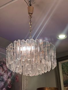 a chandelier hanging from the ceiling in a room