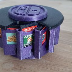 an odd looking purple object on top of a wooden table