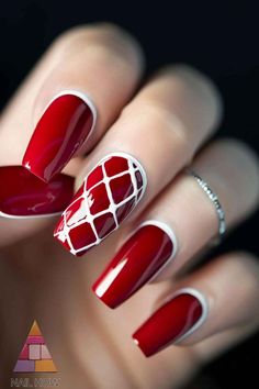 These red nails with intricate white lattice designs are perfect for adding a stylish touch to your fall wardrobe. The combination of patterns makes them stand out. Discover more trendy nail ideas at NailHow.com and save this pin!