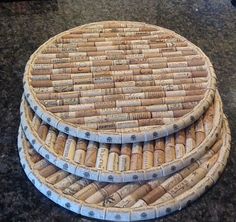 three wine cork coasters stacked on top of each other