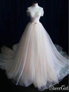 a white wedding dress on a mannequin