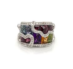 "This is a gorgeous band ring by designer Bellarri, it is crafted from 18k white gold a double wire band with open sides. The front has a 14mm width and in between the diamond border are rectangle and square shape colored gemstones, blue topaz, garnets, peridot, citrine and amethyst. Partial flower design are over the stones decorated with more diamonds, all totaling 33 points. The ring has the designer hallmark with the gold content. Brand:   Bellarri Hallmark:  Bellarri 18k Diamond:  0.33ct  G Colored Gemstones, Wide Band Ring, Eternity Band Ring, Gold Filled Ring, Gold Band Ring, 18k Yellow Gold Ring, Wide Band Rings, White Gold Band, Gold Plated Rings