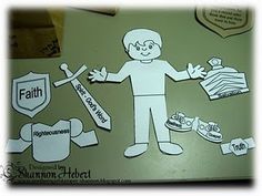 a paper cut out of a man surrounded by other items