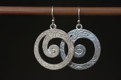 "Silver Dangle Boho Earrings / Dangle Drop Earrings / Boho Jewelry / Bohemian Earrings / Gift for women / Gift for her These boho earrings are made with silver plated swirl featuring floral design. They hang from sterling silver ear wires. They are light, comfortable and easy to wear everyday. Finish of the main pieces : Antique Silver Plated floral swirl Length : 1 3/8 inches including the sterling silver ear wires Ear wires : Sterling silver ear wires For more choices on my silver boho earring Handmade Silver Swirl Earrings, Bohemian Silver Earrings With Artistic Design, Handmade Bohemian Swirl Earrings, Nickel Free Silver Swirl Earrings, Bohemian Silver Swirl Jewelry, Unique Silver Swirl Earrings, Boho Earring, Rustic Earrings, Bohemian Earrings