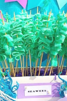 there are some cake pops with green frosting on them