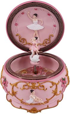 a pink musical box with a ballerina on it