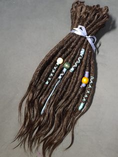 Hi, Friend!  Human Hair Dreadlock Extension Permanent Natural Dreads 100% Real Hair Decorations for dreadlocks as a gift) 💜Natural looking  💜Thickness is 0.2-0,3 inch (5-7 mm) 💜Length: 9 - 28 inches ( 20-70 cm) 💜Material: human hair , Slavic and European human hair, all hair is very soft and smooth, the extentions are ready to be attached to the ends of existing dreadlocks. 💜Full set:  Thin hair - 40 dreads Medium hair - 50 dreads  Thick hair - 60-70 dreads On the photo my work!! * If you want other color, write me!  Look at the palette at the end. And write numbers tint. * On the photo my work! * Made by backcomb and crochet method. Write me questions in private messages! Human Hair Dread Extensions, Permanent Dreadlock Extensions, Brown Dreads, Hippie Dreads, Hair Dreads, Dreads Styles For Women, Ombre Dreads, Natural Dreadlocks, Natural Brown Hair