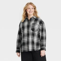 This Oversized Flannel Long-Sleeve Collared Button-Down Shirt from Universal Thread™ makes a versatile addition to your wardrobe. Made from midweight cotton, this collared shirt features a front button placket, long sleeves with buttoned cuffs, a patch pocket on the chest and a box-pleat back yoke for classic touches. The oversized fit and shirttail hemline complete the design, allowing you to wear it tucked in, untucked, layered open and unbuttoned, or with rolled-up sleeves. Universal Thread™: Oversized Black Flannel Shirt For Fall, Oversized Button-up Winter Shirt, Winter Oversized Button-up Shirt, Oversized Long Sleeve Flannel Shirt With Buttons, Oversized Black Button-up Flannel Shirt, Oversized Collared Winter Shirt, Oversized Collared Winter Blouse, Oversized Collared Blouse For Winter, Oversized Flannel