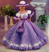 a crocheted doll in a dress and hat is featured for the ebay catalog