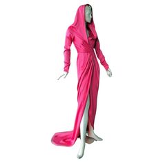 Elsa Schiaparelli's iconic "Shocking Pink" evening dress. Fully fashioned in silk charmeuse with attached hood and cross-over waist closure. Slender sleeves with zipper wrists. Full dramatic train enhances the look. Fantastic fashion flair in this deco inspired 2021 gown. This collection boasts exciting and dramatic entrance pieces. Definitely a standout piece. Size: 40; bust: to 34"; waist: approx 25"; hips: approx 38"; length: approx: 66" Condition: brand new; excellent Hood Dress, Pink Evening Dress, Elsa Schiaparelli, Shocking Pink, Dress Gown, Moda Vintage, Silk Charmeuse, Pink Vintage, Pink Silk