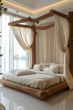 a large bed sitting in the middle of a room next to a window with drapes on it