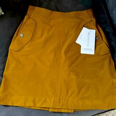 This Skirt Is A Deep Mustard Color Is Gorgeous! Light As A Feather And Sits At The Waist. Featherweight Stretch ! Athleta Shorts, Light As A Feather, Rayon Pants, Mustard Color, Jelly Shoes, Walker Boots, Pajama Shirt, Blush Makeup, Skorts