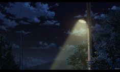 a street light in the middle of a night sky with clouds and stars above it