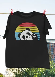 "Product: Retro Panda Cute Panda Bear Vintage Classic T-Shirt, Panda Shirt, Panda Lover Shirt, Cute Panda Shirt, Bear Shirt, Animal Lover Shirt 💫 Welcome to our store! ✔️ PRODUCTS DETAIL: ▸ Available ALL types of clothing you NEED (8 types from kid to adult, hoodies, sweatshirts, tanktop,..) ▸ Light & Soft cotton fabric (Some colours contain polyester). ▸ High-quality Direct To Garment printing, guaranteed not to wash off or fade. ▸ Fit T-shirts, perfect gift idea for your family, friends... ✔️ Playful Black Crew Neck T-shirt, Playful Black T-shirt With Funny Print, Playful Black T-shirt With Screen Print, Cute Pre-shrunk Black T-shirt, Cute Black Pre-shrunk T-shirt, Panda Cute, Panda Shirt, Panda Tshirt, T Shirt Painting