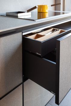 an open drawer on the side of a counter