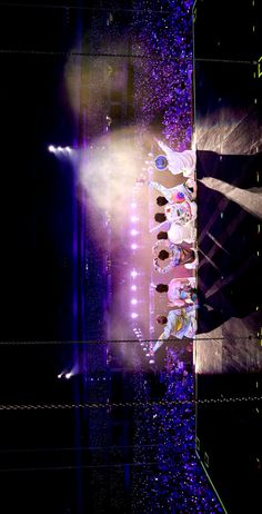 a group of people standing on top of a stage