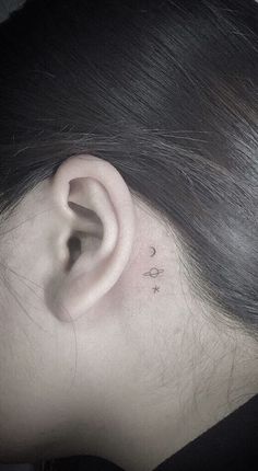 a woman's ear with the word love written on it