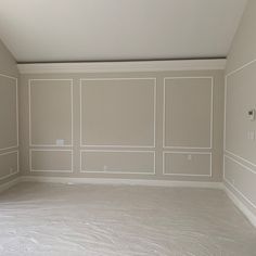 an empty room with white walls and no one on the floor or furniture in it