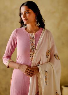 Featuring a pink mukaish kurta with printed placket and sleeve border, this set is complete with a floral block printed palazzo and a cotton dupatta with lace and fringe detailing. Additionally, the kurta has pockets. Composition : Kurta: Mukaish Mul Cotton Lined With Mul Cotton, Palazzo: Cambric Cotton, Dupatta: Mul Cotton Care: Dry Clean Only and Vacuum Storage All products can be customised for sleeves, length of blouse and neck design Delivery : 4-6 weeks as the product is hand crafted. Check Size Guide or choose MySize for free customisation (All Sizes above XL can be made at 15% additional cost) For more information and sizes please contact fabiliciousfashion@gmail.com or visit our Copenhagen studio. Cotton Palazzo Set With Gota Work And Long Sleeves, Cotton Long Sleeve Palazzo Set With Gota Work, Long Sleeve Cotton Palazzo Set With Gota Work, Designer Cotton Sharara With Printed Motifs, Cotton Sharara With Printed Motifs For Designer Wear, Cotton Palazzo Set With Gota Work, Traditional Pink Sharara With Printed Motifs, Bollywood Style Pink Cotton Palazzo Set, Pink Cotton Anarkali Set For Festivals