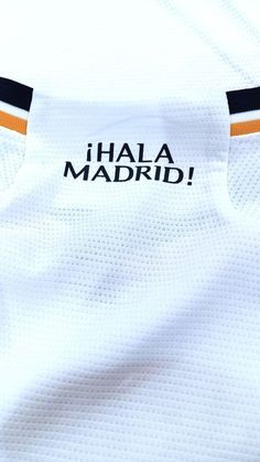 the back of a white jersey with black and orange stripes on it, that says i'lla madrid