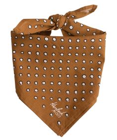 a brown bandana with white dots on it