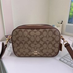 Brand : Coach Line : Signature Type : Crossbody Bag Material : Coated Canvas , Leather Color : Brown Gender : Womensize (Hxwxd) : 15.5cm X 25cm X 8.5cm / 6.1'' X 9.84'' X 3.34'' Strap Length : 107.5cm / 42.32'' Coated Canvas Crossbody Box Bag For Travel, Travel Crossbody Box Bag In Coated Canvas, Coated Canvas Crossbody Box Bag With Detachable Strap, Crossbody Box Bag In Coated Canvas With Detachable Strap, Coated Canvas Shoulder Box Bag With Removable Pouch, Coated Canvas Box Bag With Detachable Strap Crossbody, Coated Canvas Box Bag With Removable Pouch, Coated Canvas Crossbody Shoulder Bag, Coated Canvas Crossbody Shoulder Bag With Adjustable Strap