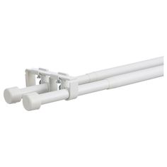 two white plastic pipes are attached to the side of a wall mounted fixture with one end closed