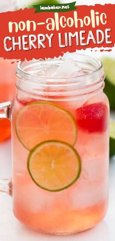 a mason jar filled with pink lemonade and lime