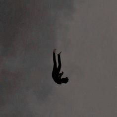 a person is in the air on a cloudy day