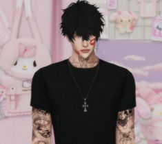 a man with black hair and tattoos standing in front of a pink wall wearing a cross necklace