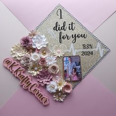 a graduation cap with flowers on it and a photo pinned to the side that says, i did it for you