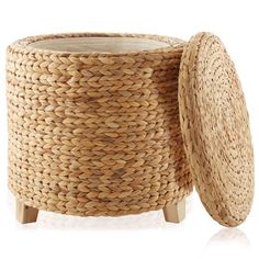 a woven basket with a lid and wooden legs