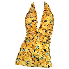 Sexy vintage FENDI, by Karl Lagerfeld, early 1990s silk halter top! Features awesome prints of fish throughout. Plunging neckline, with ruffles at bodice and waist. Very flattering. Mustard Yellow color, with blue and red fish. Can easily go from day to night. Great with shorts or jeans for day, and perfect with a skirt for evening. In great condition. Made in Italy Approximately Size Small - Medium (lots of stretch) Measurements: 32-40 inch bust 26-34 in waist (elastic waistband) Karl Lagerfeld Fendi, Fendi Outfit, Halter Neck Tops, Fendi Runway, Plunging Neckline Top, Vintage Halter Top, Yellow Halter Top, Silk Halter Top, Flounce Top