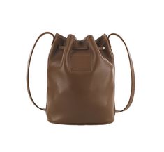 When it comes to a cool carry-all for just the essentials that's perfect on the go, it doesn't get much better than this bucket bag. Gracie features a rich, full-grain, unlined leather body, and leather drawstring strap for long lasting, laid-back style. Comfortable to wear over the shoulder or across the body, keeping your essentials close at hand and easily accessible.
Handcrafted in the U.S.A. (7.00"W, 8.50"H, 3.25"D) Leather Bucket Satchel For On-the-go, Leather Bucket Bag For On-the-go Use In Fall, Classic Brown Bucket Bag For On-the-go, Brown Soft Leather Bucket Bag For On-the-go, Fall Leather Bucket Bag, Chic Leather-lined Bucket Bag For On-the-go, Chic Brown Duffle Bag For Daily Use, Fall Travel Bucket Bag, Classic Bucket Bag With Dust Bag For On-the-go